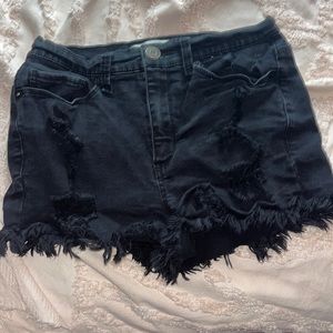 black ripped short jeans